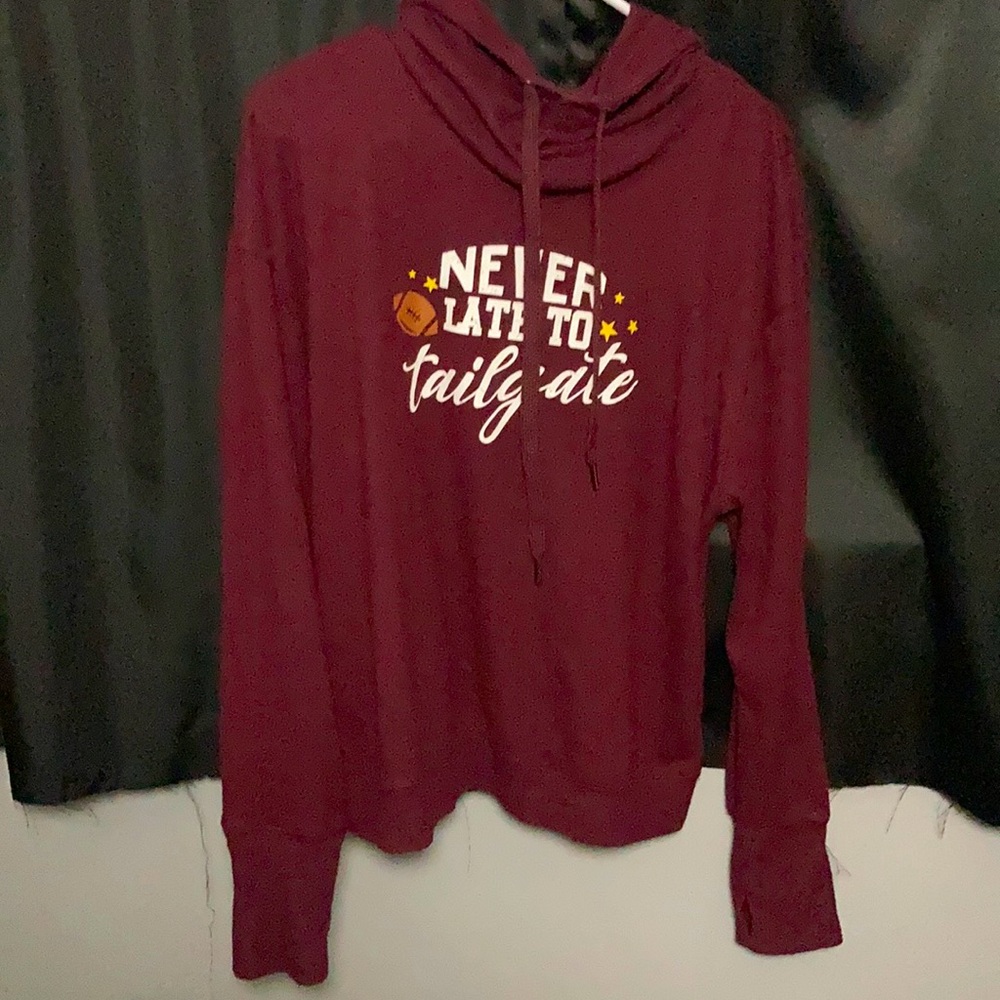 Women’s sweatshirt reading “Never too late to tailgate”